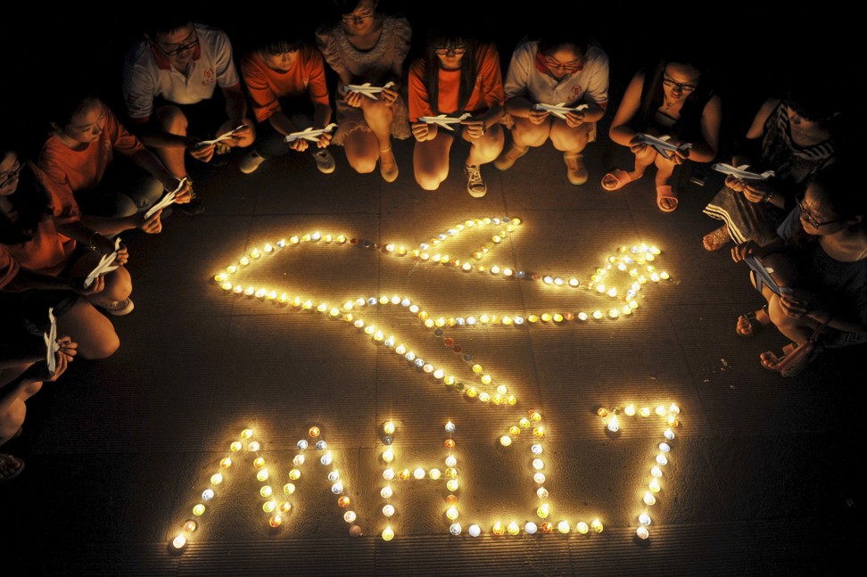 Students at a university in Yangzhou, Jiangsu province, during a 2014 candlelight vigil for victims of the downed MH17. Photo: Reuters