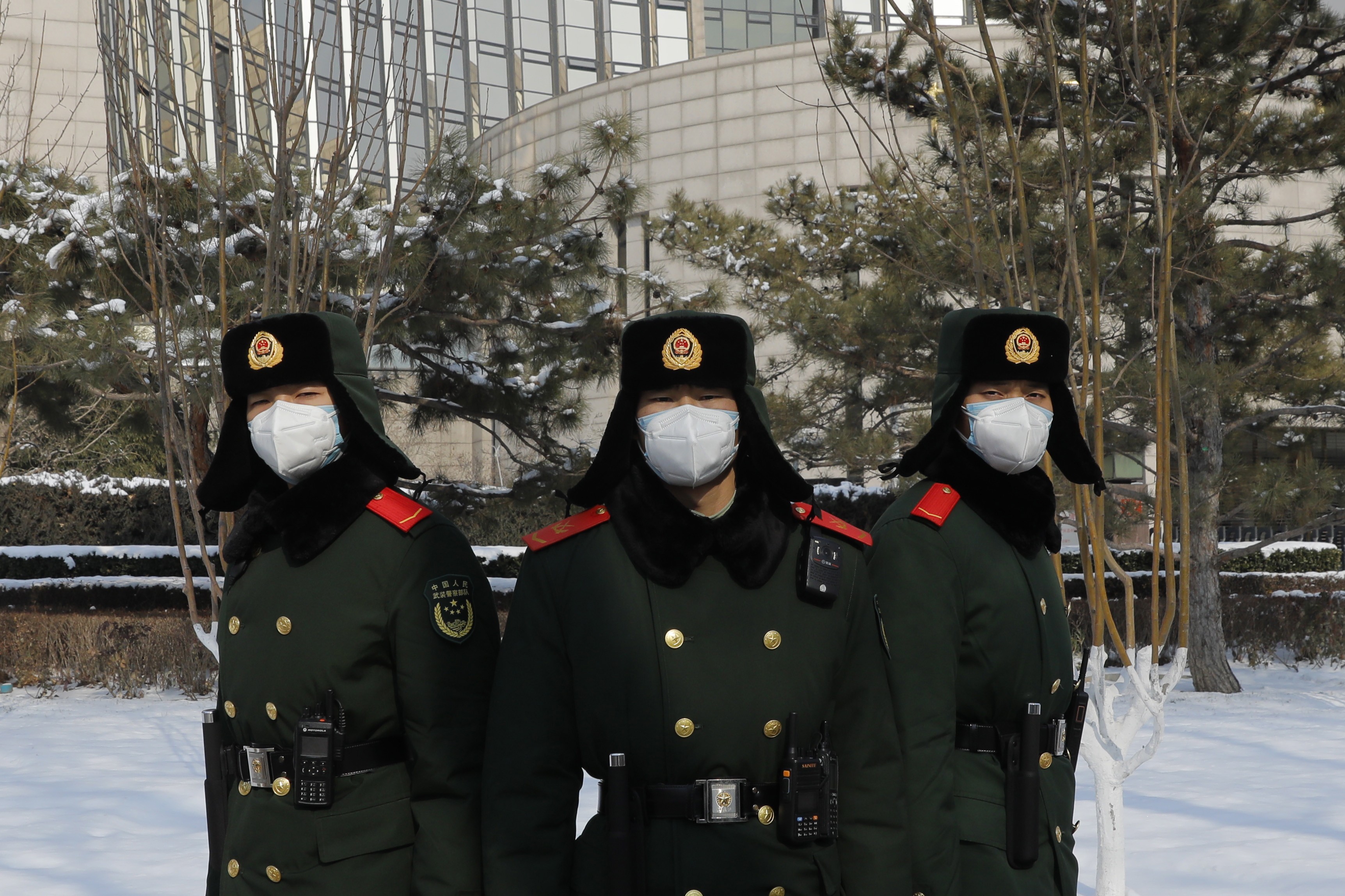 Chinese paramilitary police officers wearing face masks stand outside the headquarters of the People's Bank of China in Beijing on February 7. While some analysts have said China’s economy could be adversely affected by the coronavirus, the Chinese central bank has already injected a large amount of liquidity into the system. Photo: EPA-EFE