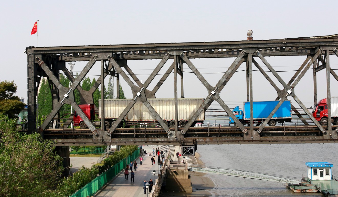 Trucks at at the Chinese end of the Friendship Bridge that connects North Korea and China. The North does more than 90 per cent of its trade with China. Photo: Reuters