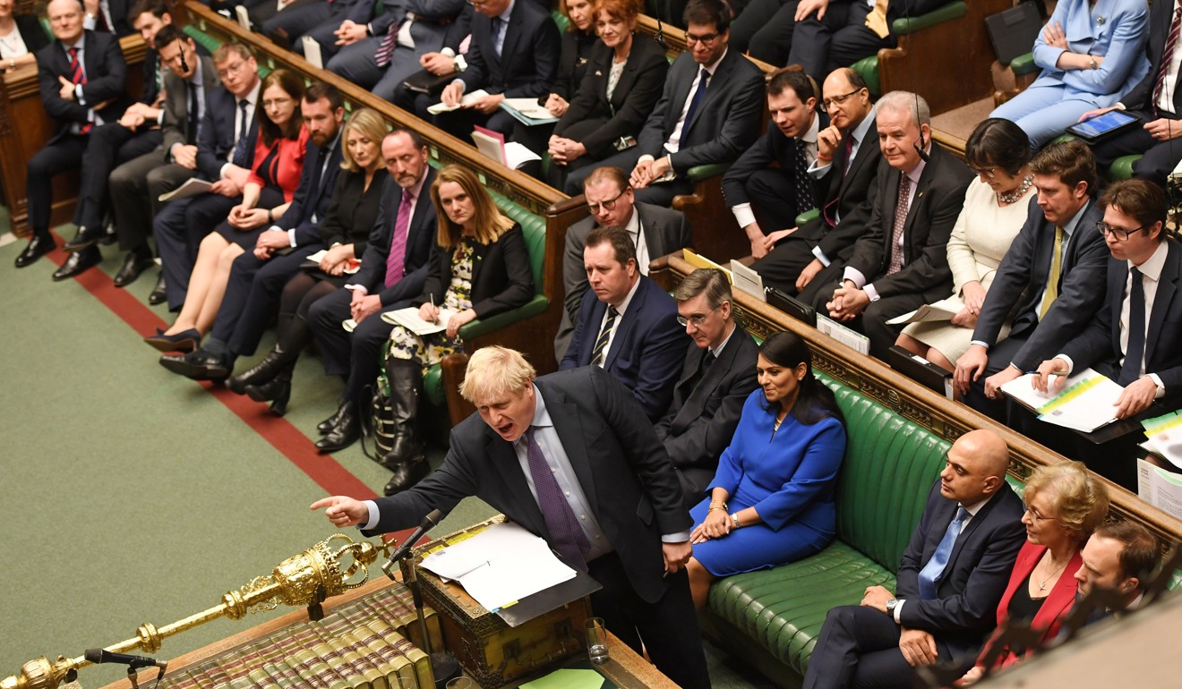 Britain's Prime Minister Boris Johnson sits with cabinet colleagues during the weekly question time debate in Parliament in London on February 12. Photo: Reuters