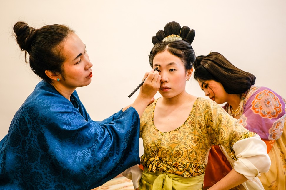 (From left) Gong Pan Pan and fellow Hanfugirls Chong Lingying and Madeline Xiong preparing their make-up for a photo shoot. Photo: Hanfugirls Collective