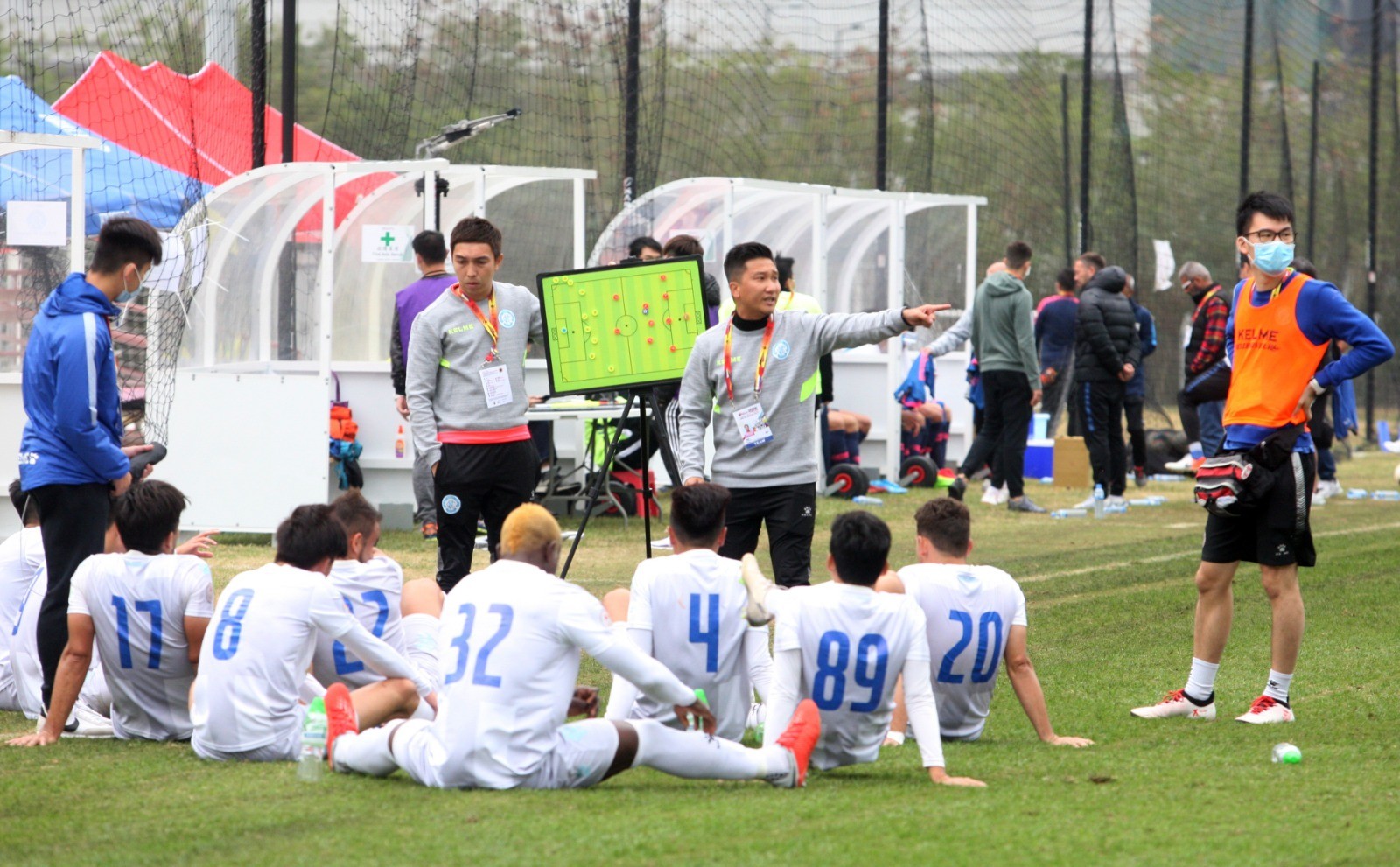 BC Rangers conduct their half-time talk on the pitch because the changing rooms at Tseung Kwan O Training Centre are too far away. Photo: Chan Kin-wa