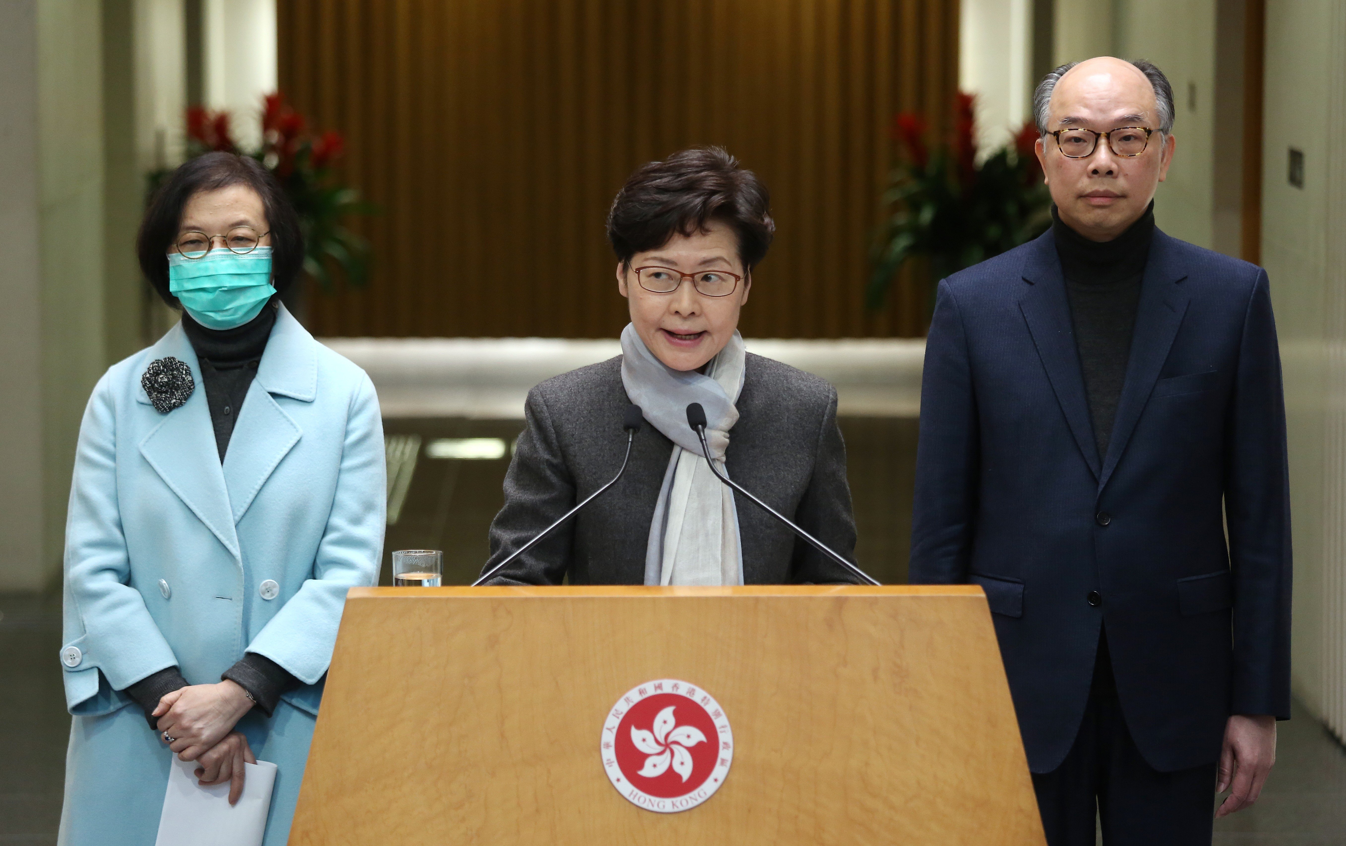 Chief Executive Carrie Lam, flanked by Secretary for Food and Health Sophia Chan Siu-chee and Secretary for Transport and Housing Frank Chan Fan, meets the media on February 11. Photo: Jonathan Wong