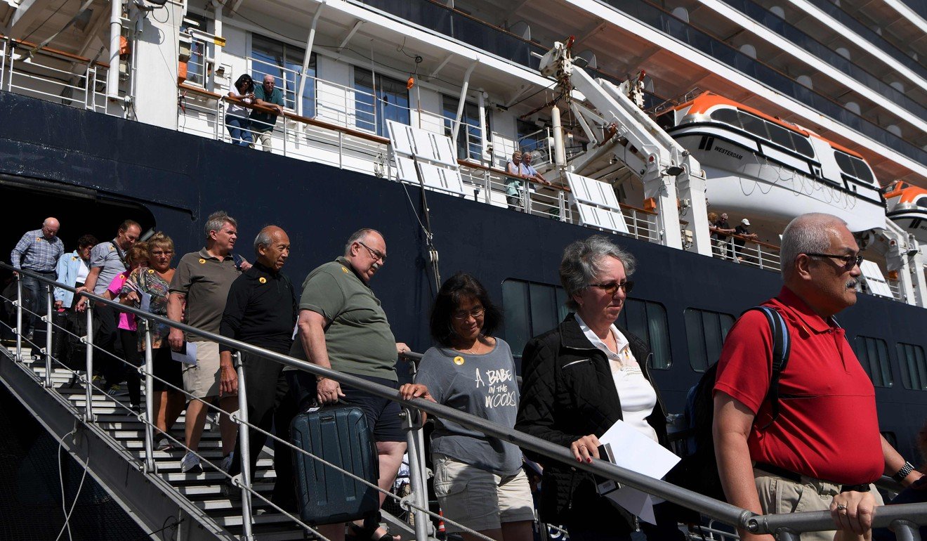Passengers disembark from the Westerdam cruise ship in Sihanoukville on February 15, 2020. Photo: AFP