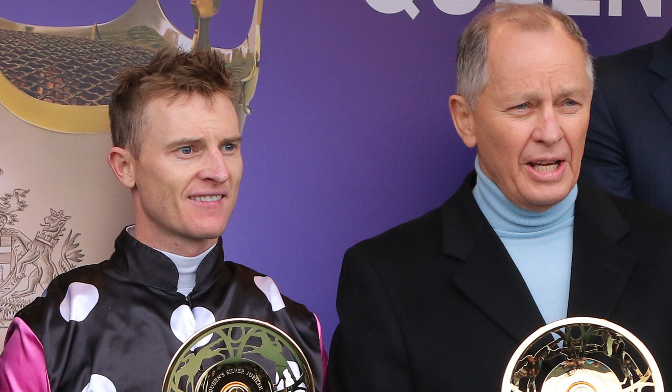 Jockey Zac Purton and trainer John Moore celebrate Beauty Generation’s win.