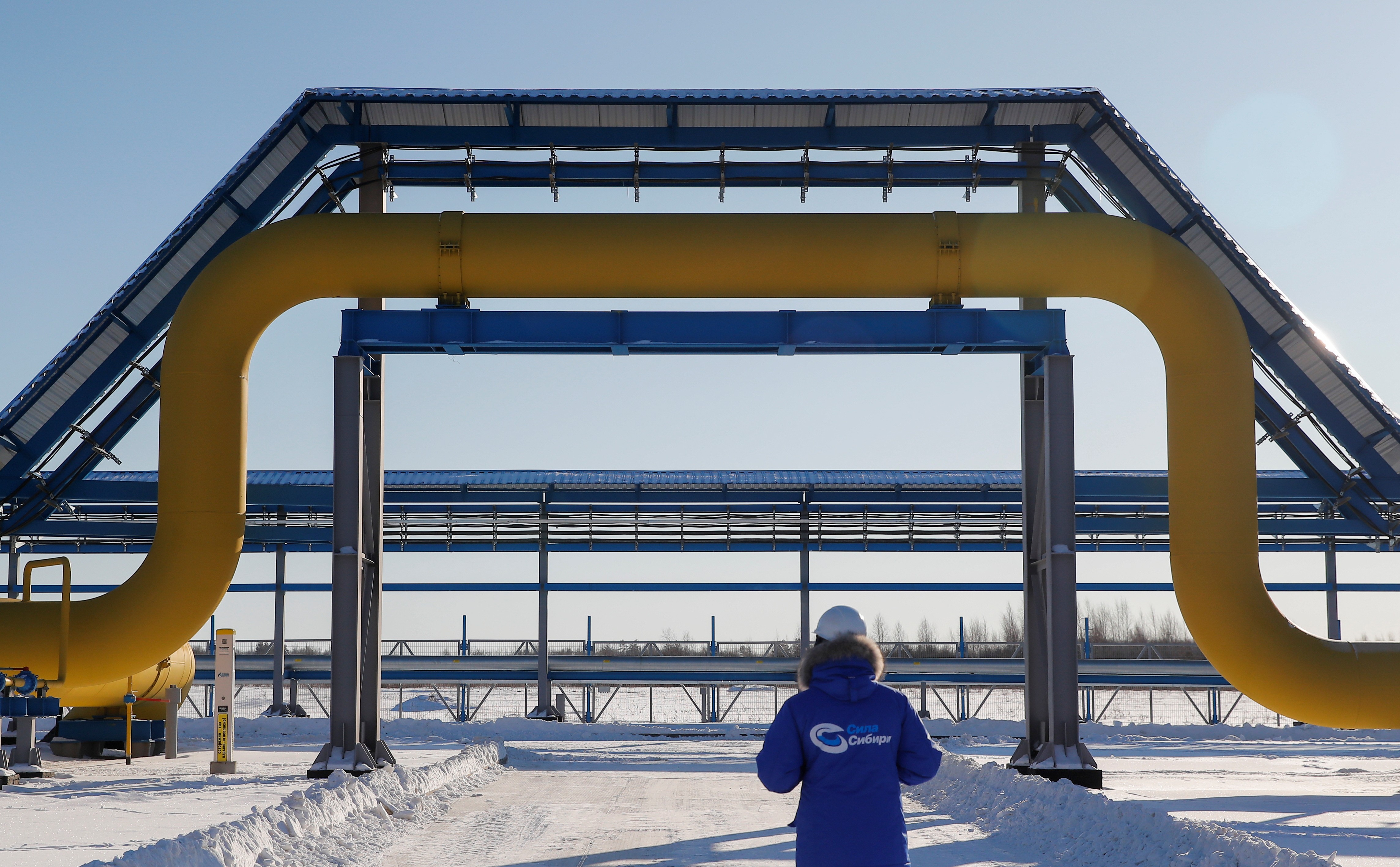 A Gazprom employee surveys the Power Of Siberia gas pipeline at the Atamanskaya compressor station in Russia’s Amur region on November 29. Photo: Reuters