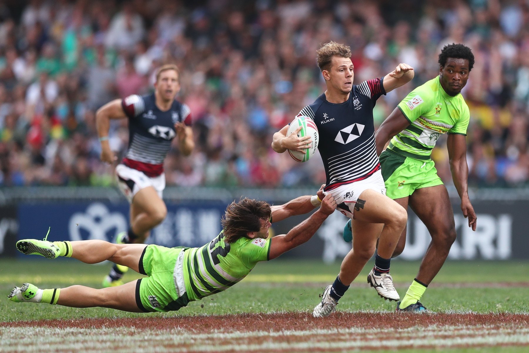 Seb Brien eludes a tackler from Zimbabwe during the Challenger Series. Photo: World Rugby