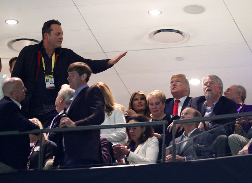 Actor Vince Vaughn greets Donald and Melania Trump at a college-football game, for which he was ‘cancelled’. Photo: : Mark J. Rebilas / USA Today Sports