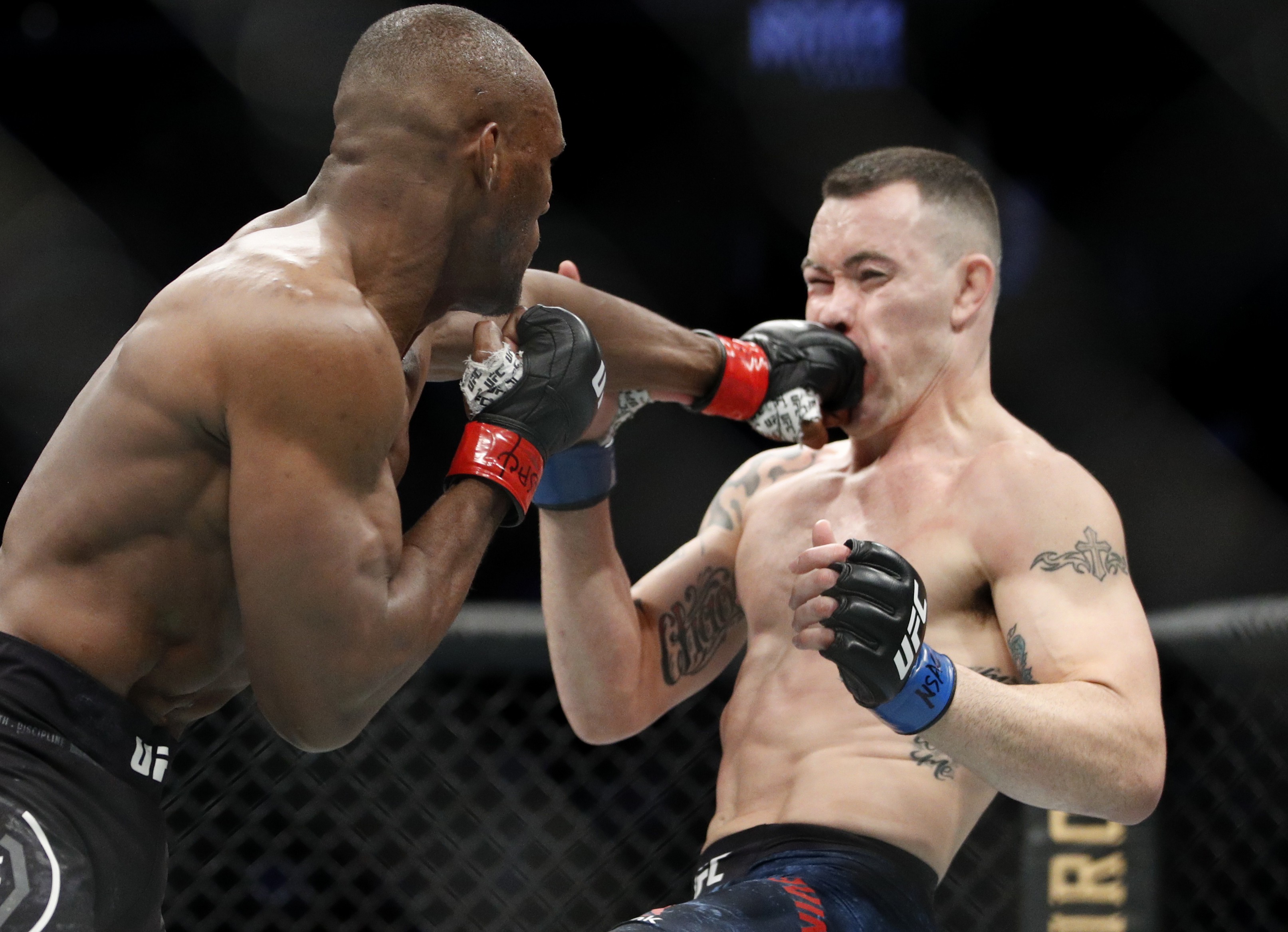 Kamaru Usman hits Colby Covington at UFC 245. Photo: AP