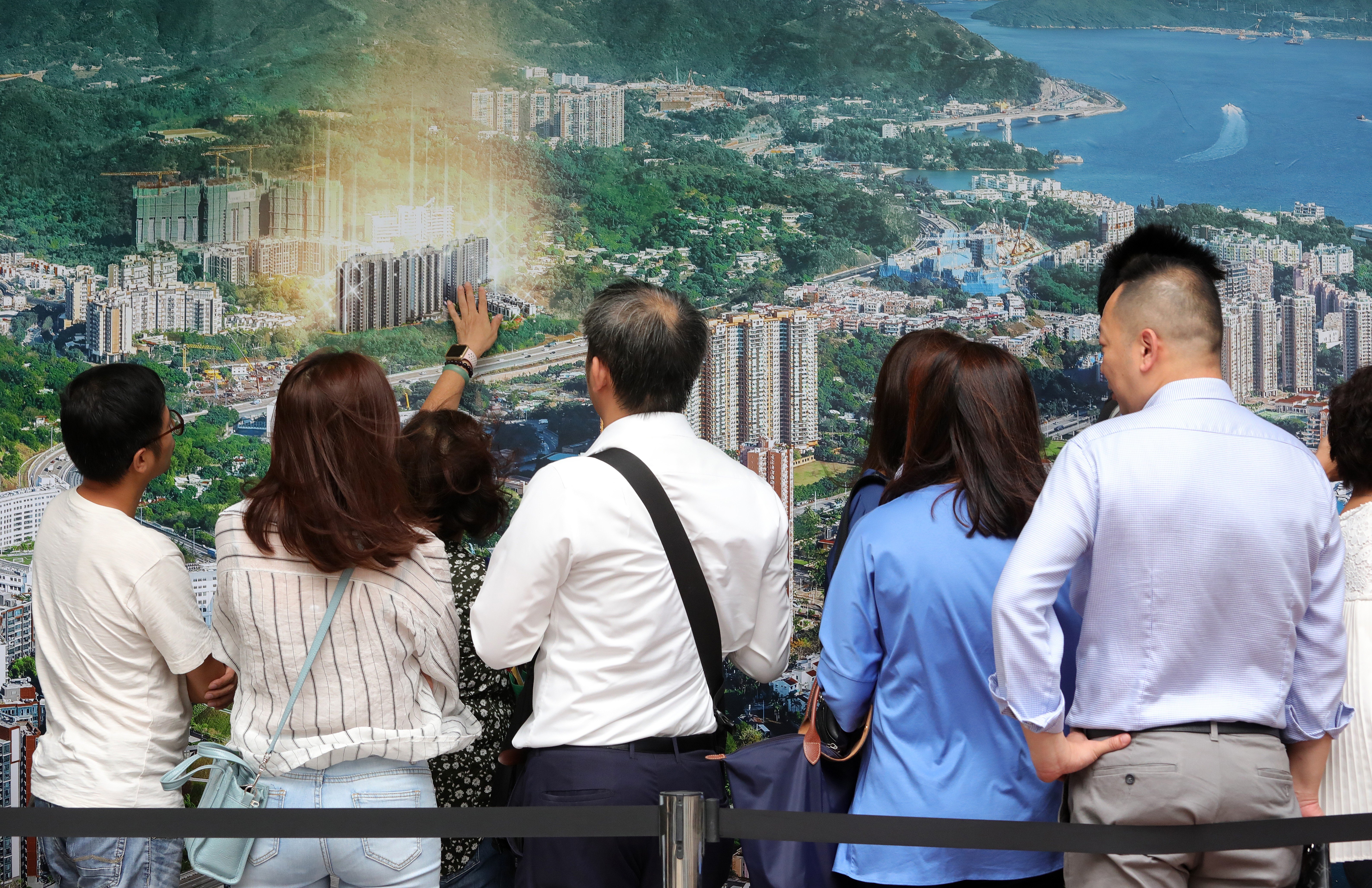 In this October 2019 file photo, potential buyers queue up to buy flats at the Emerald Bay project developed by Evergrande Group. Photo: May Tse