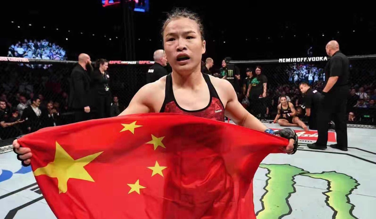 Zhang Weili celebrates with the Chinese flag, after beating Jessica Andrade in Shenzhen. Photo: Brandon Magnus/Zuffa