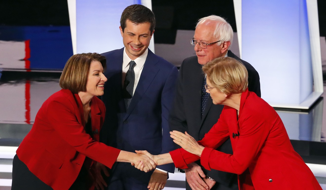 (From left) Democratic candidates Amy Klobuchar, Pete Buttigieg, Bernie Sanders and Elizabeth Warren greet each other before a Democratic primary debate in Detroit in July. Photo: AP