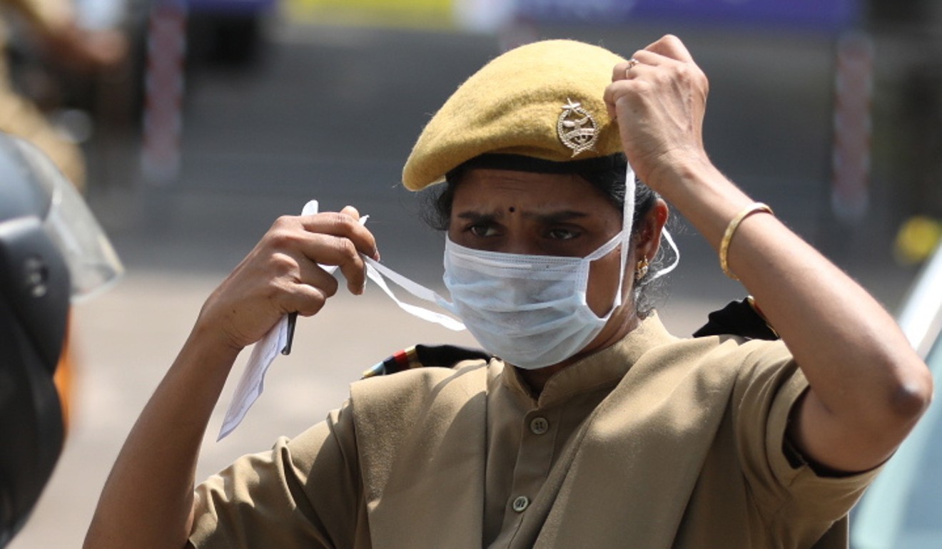 A police officer in Kochi, India wears a face mask amid fears of the coronavirus outbreak. Photo: EPA
