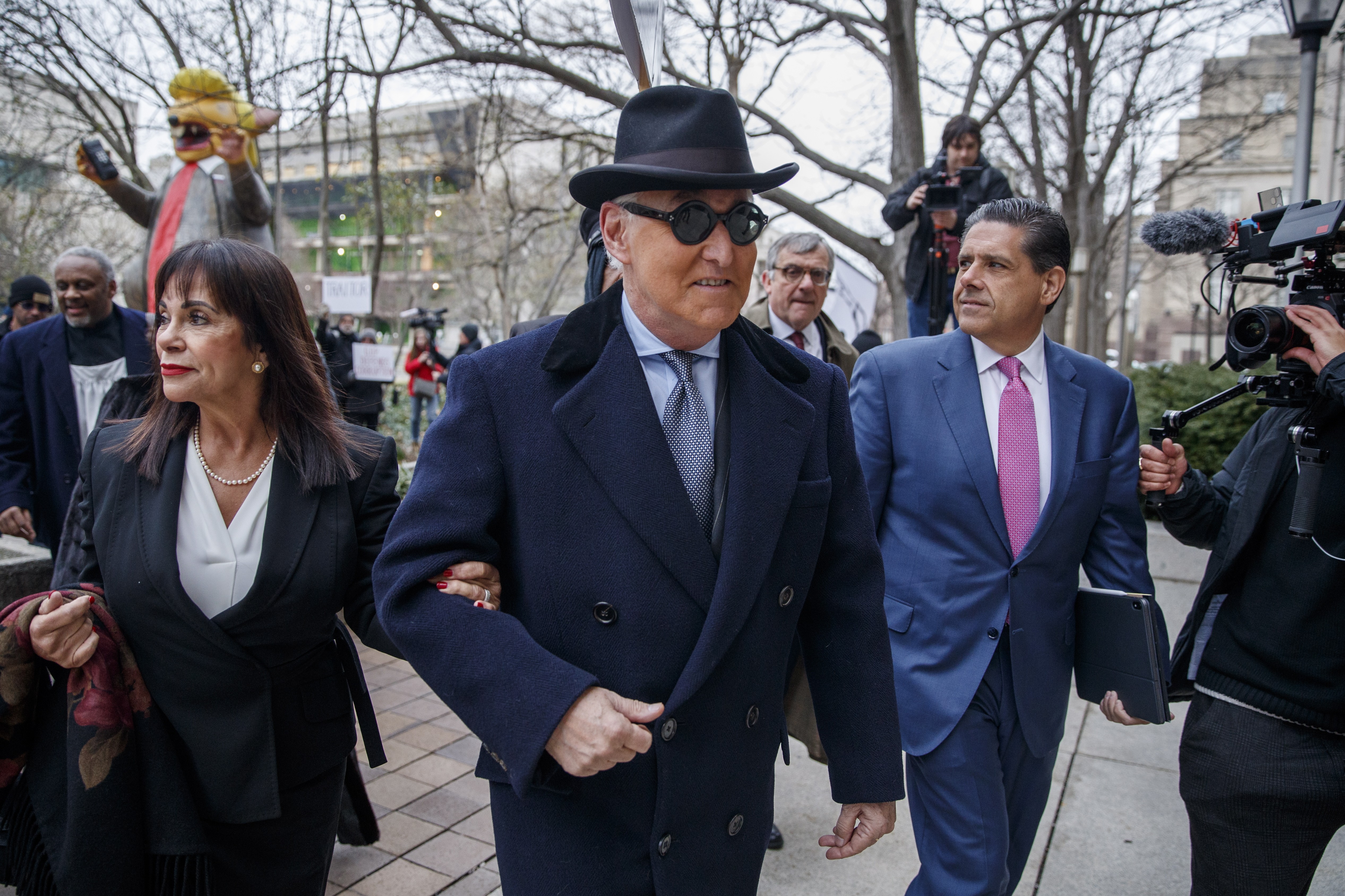 Roger Stone (centre) and his wife, Nydia (left), arrive for his sentencing hearing in Washington on Thursday. Photo: EPA-EFE