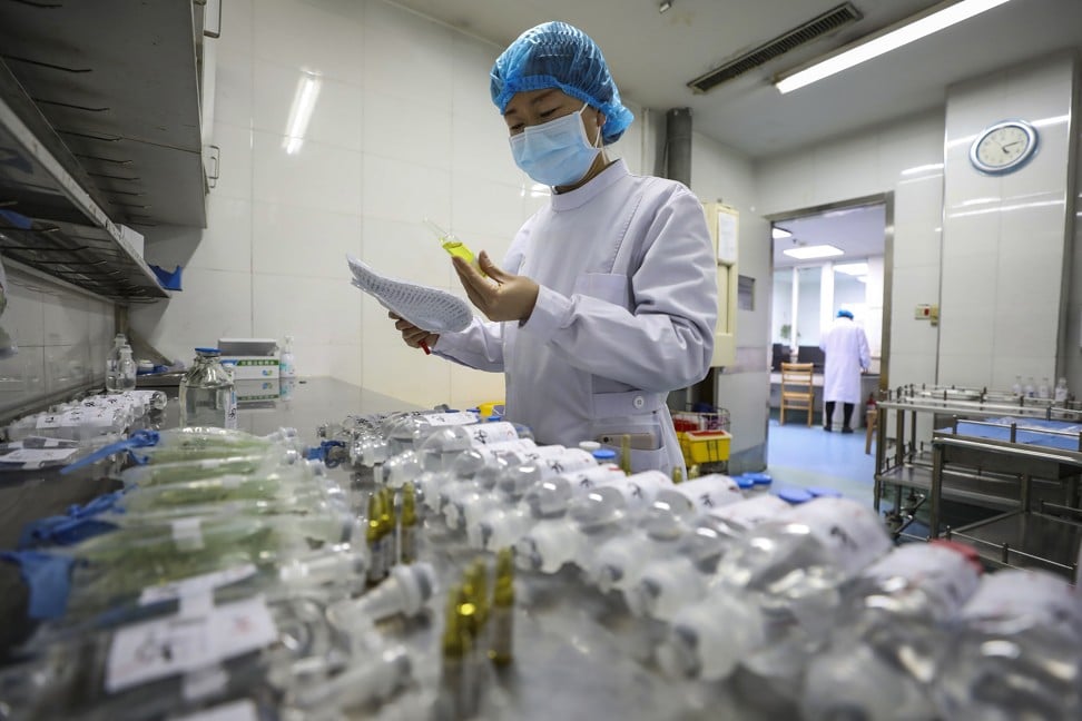A nurse prepares medicines for patients at Jinyintan hospital for new coronavirus infected patients, in Wuhan on February 16, 2020. Photo: Chinatopix