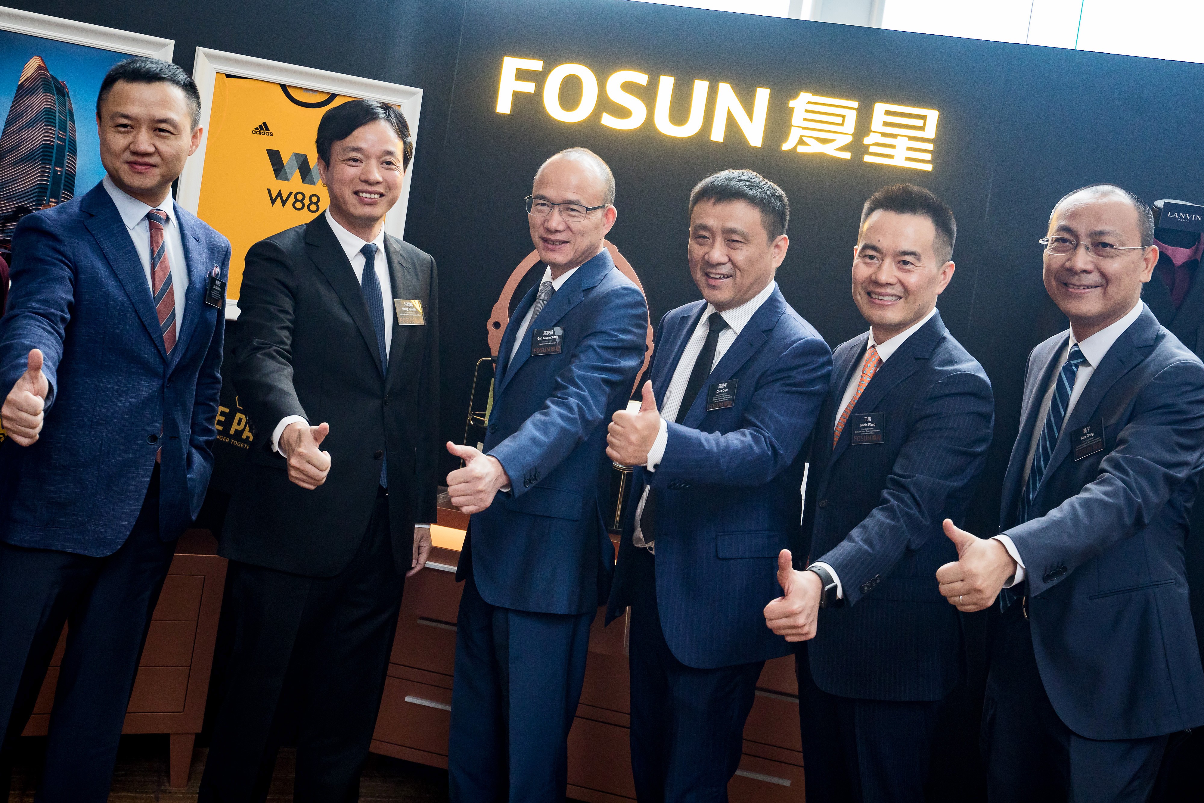 Fosun’s key management (from left) Xu Xiaoliang, Wang Qunbin, Guo Guangchang, Chen Qiyu, Robin Wang and Gong Ping pose for a photo after a briefing in Hong Kong in August 2018. Photo: Bloomberg