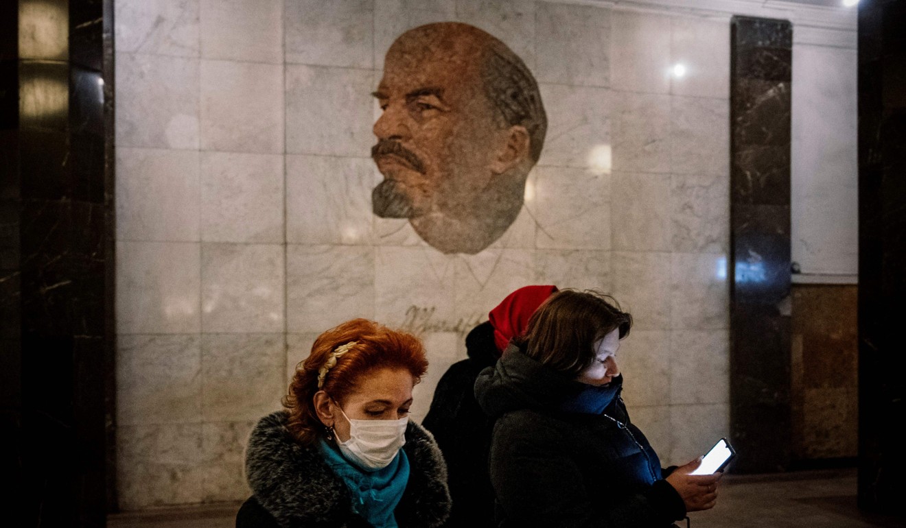 Women wearing face masks in a Moscow metro station. Photo: AFP