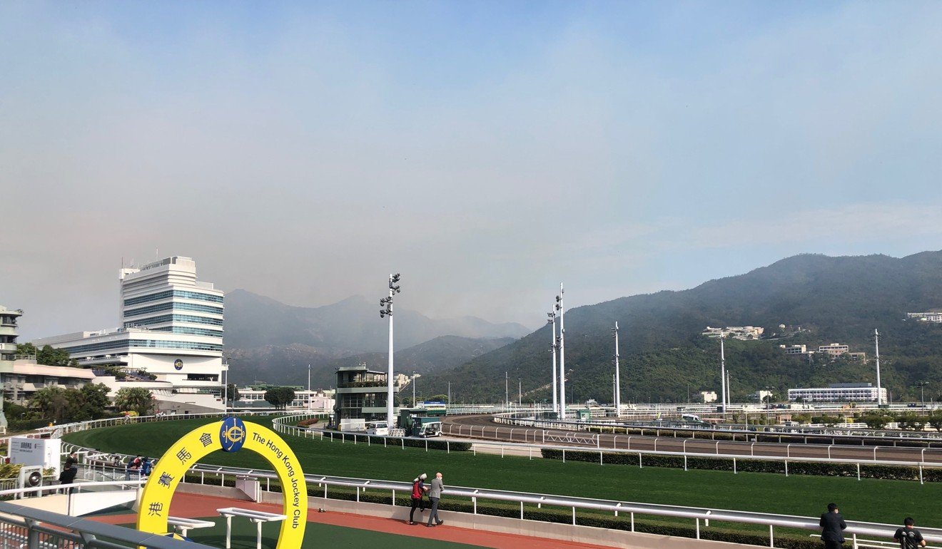 A fire burns in the hills near Sha Tin racecourse.