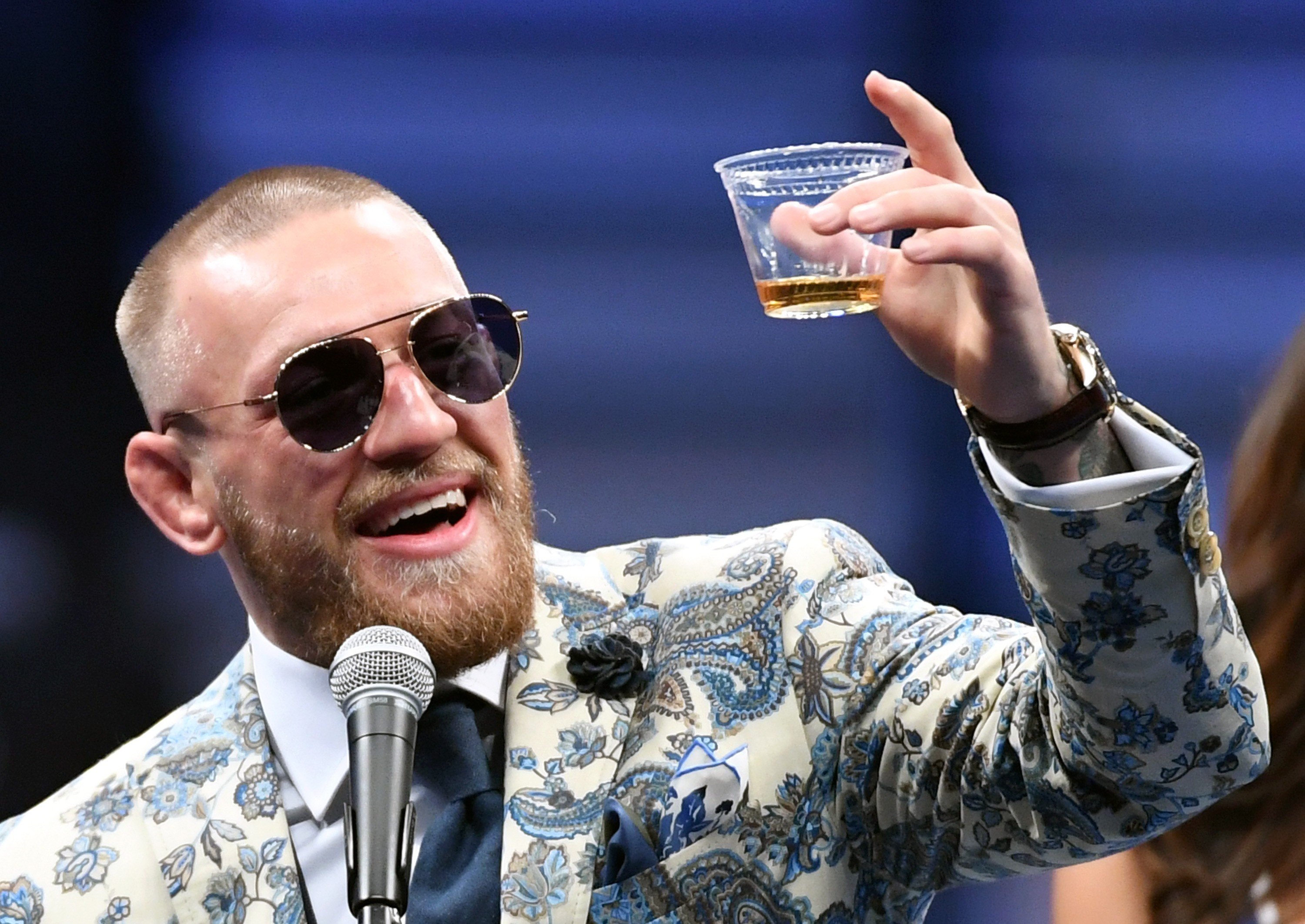 Conor McGregor celebrates his loss to Floyd Mayweather with a dram of his own branded whiskey in Las Vegas. Photo: Getty Images