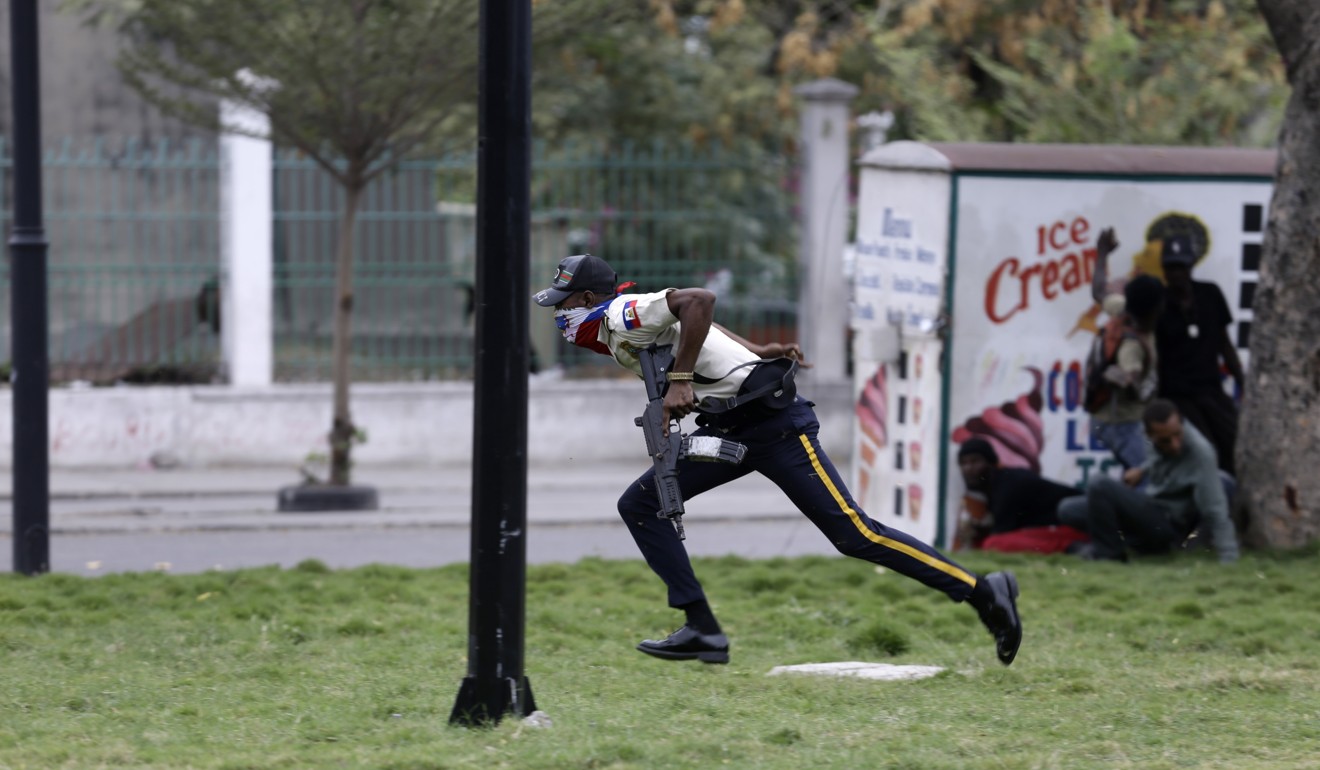 An armed police officer runs as soldiers fire in his direction. Photo: AP