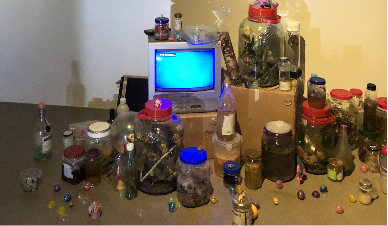 Stage two, Numbness and Denial, is a room filled with mould trapped in jars, alongside dinosaur figurines and other discarded items. Photo: Christina Ko