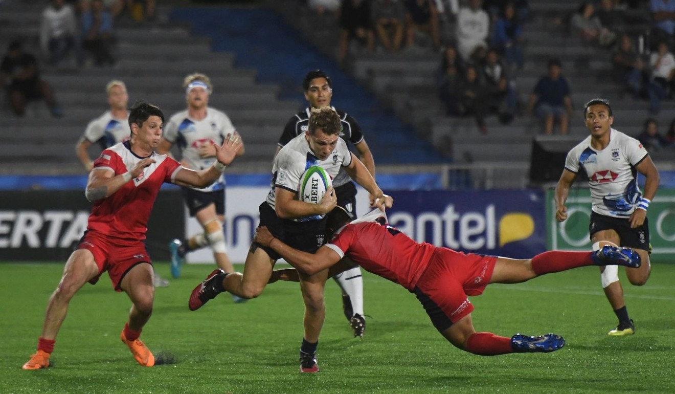 Seb Brien takes on two Chile defenders in Uruguay. Photo: World Rugby