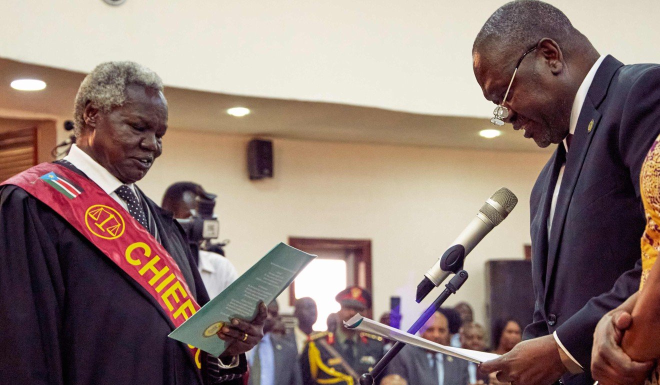 Riek Machar (right) is sworn in as the first vice-president of South Sudan. Photo: AFP