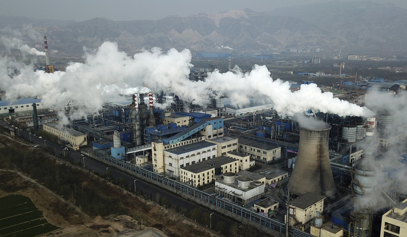 Smoke and steam rise from a coal processing plant in Hejin in central China’s Shanxi Province. Photo: AP