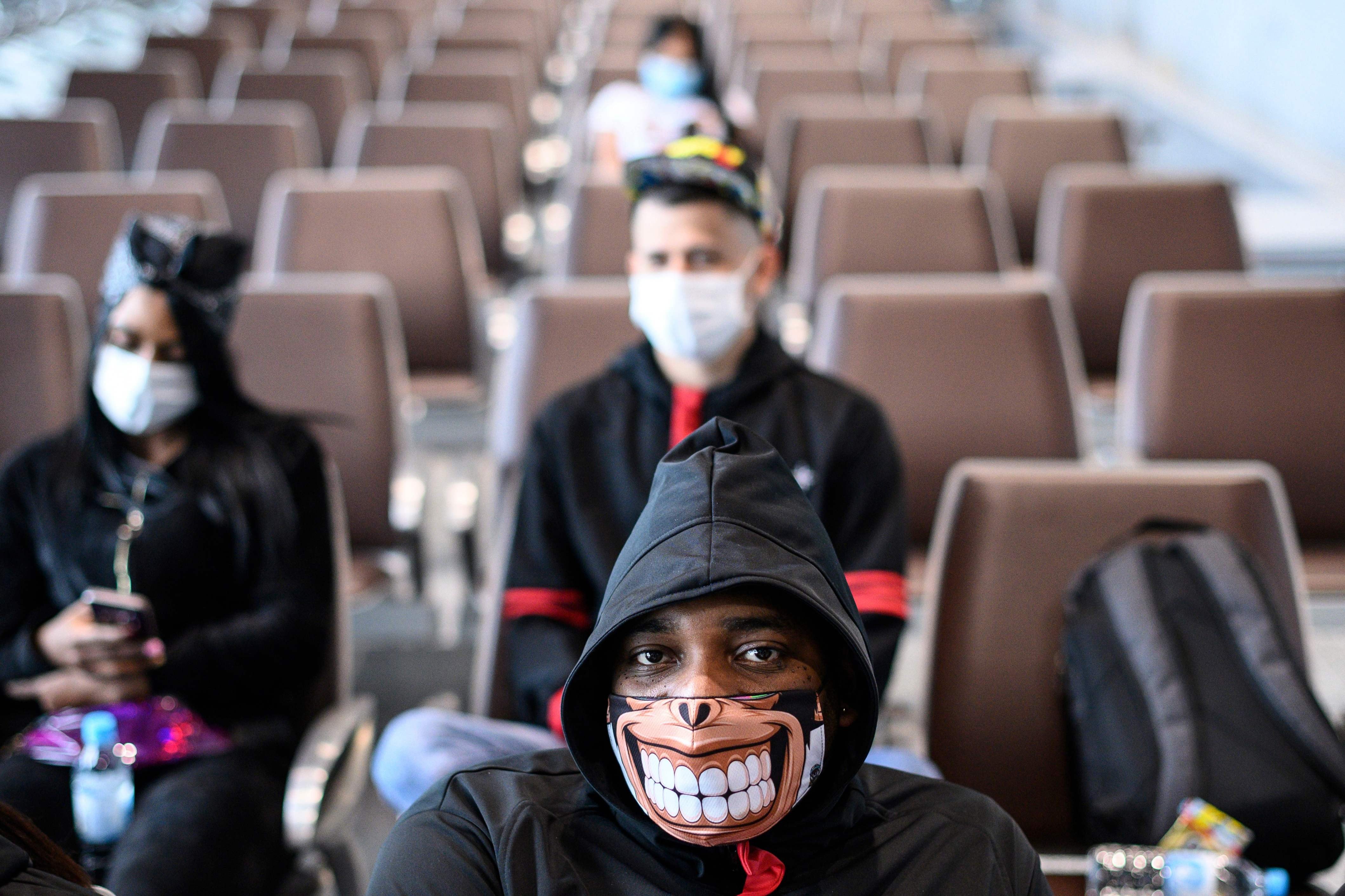 People wear masks at the Kai Tak cruise terminal on February 5. In Hong Kong and elsewhere, the lessons of Sars are helping to combat the spread of the Covid-19 coronavirus. Photo: AFP
