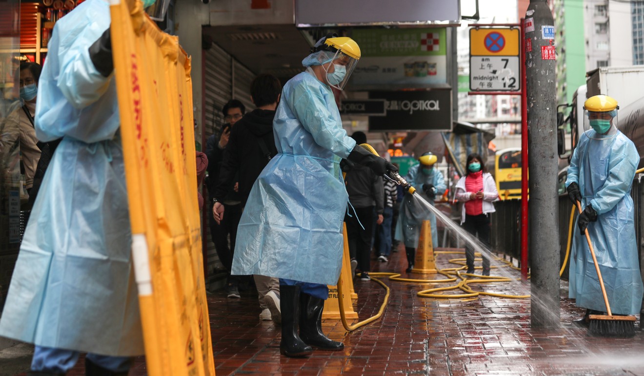 The area outside Fook Wai Ching She Buddhist worship hall on King’s Road is cleaned on Tuesday morning. Photo: Xiaomei Chen