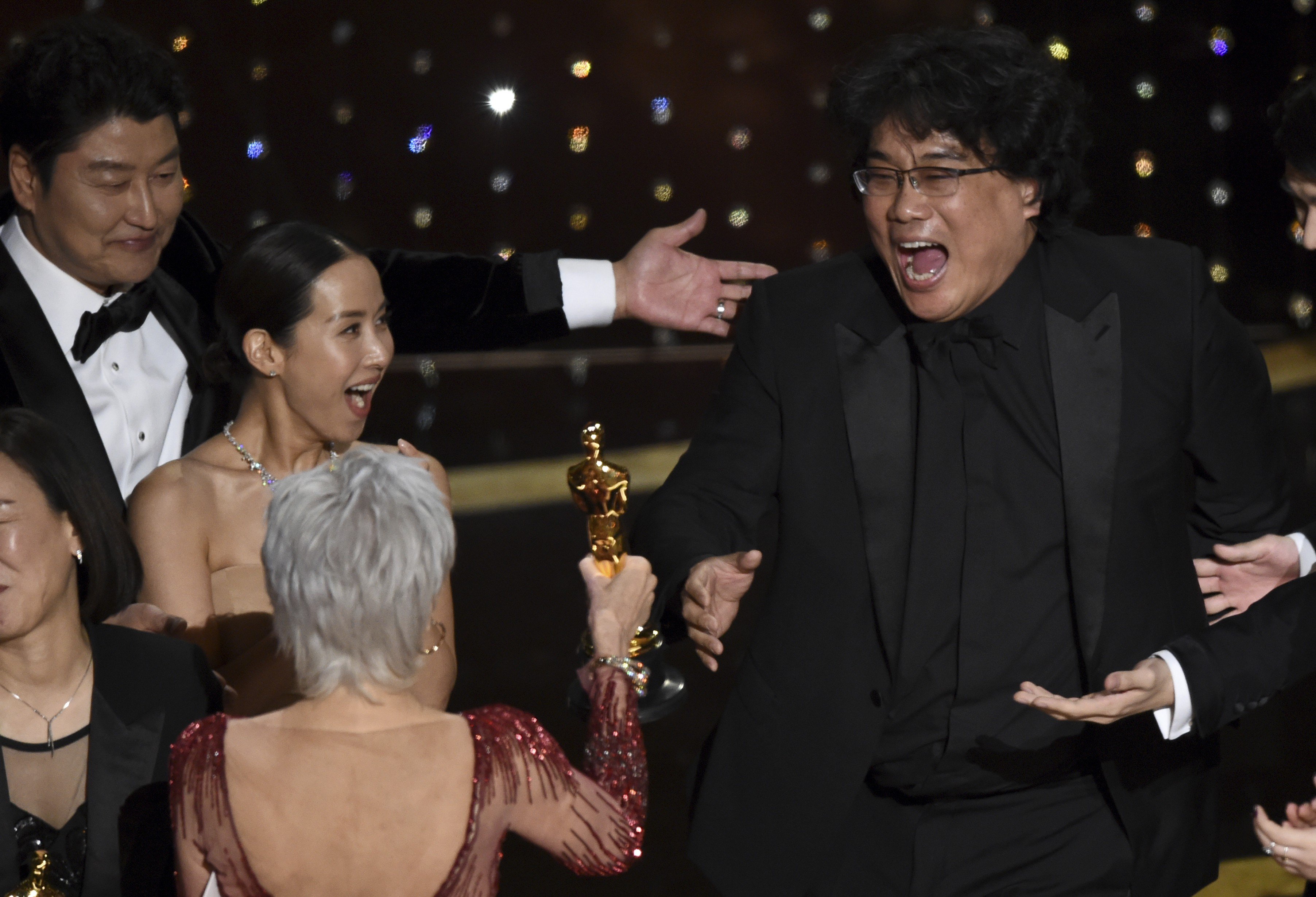 Bong Joon-ho (right) reacts as he is presented with the award for best picture for Parasite at the Oscars. Photo: AP