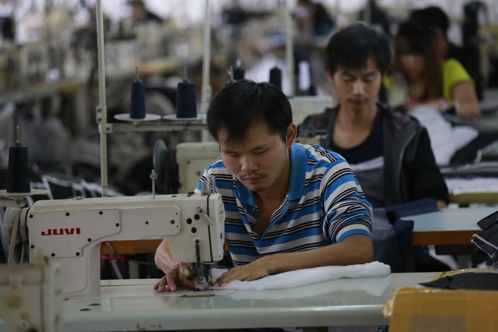 Workers in a garment factory production workshop in Jiangxi, Jiujiang, processing exports. Photo: Shutterstock