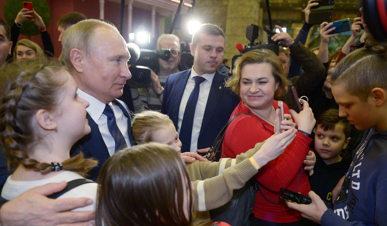 Russian President Vladimir Putin meets with visitors at the Dream Island amusement park in Moscow. Photo: Reuters