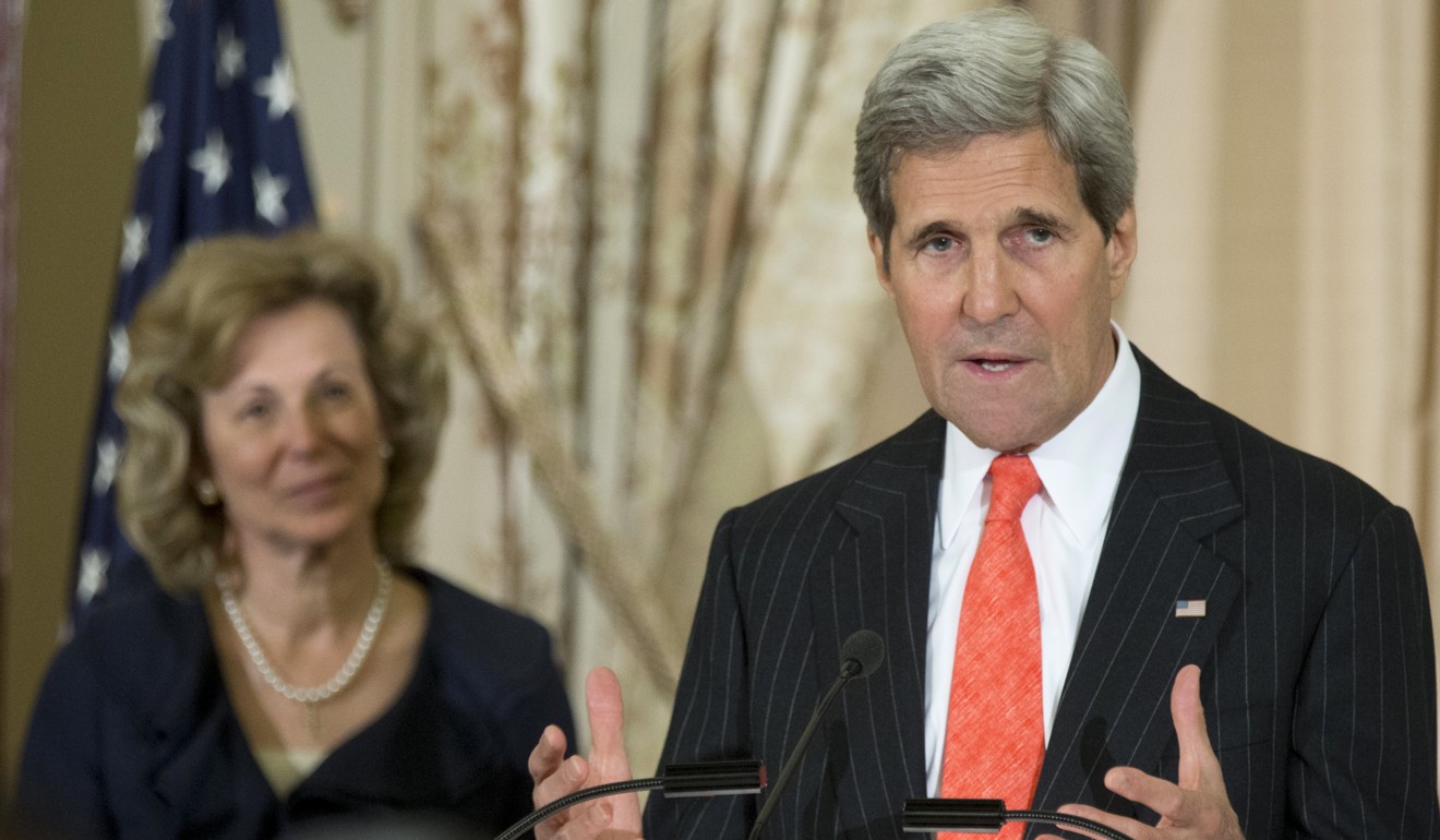 Secretary of State John Kerry speaks during an April 2014 swearing-in ceremony for Debbie Birx (left) as ambassador-at-large and coordinator of US government activities to combat HIV/Aids. Photo: AP
