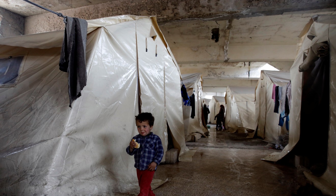 An internally displaced Syrian boy at a camp in Idlib. Photo: Reuters