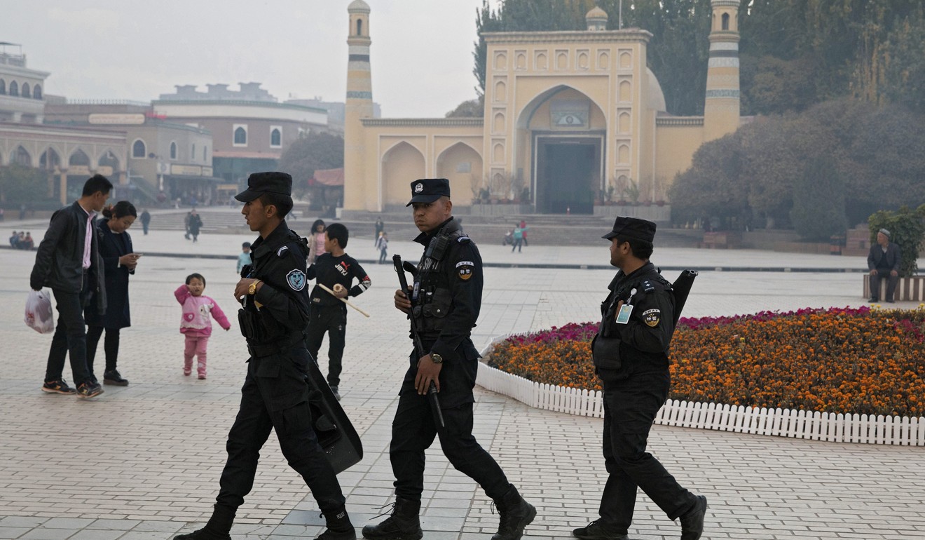 Security personnel patrol near the Id Kah Mosque in Kashgar, Xinjiang region, in 2017. Photo: AP