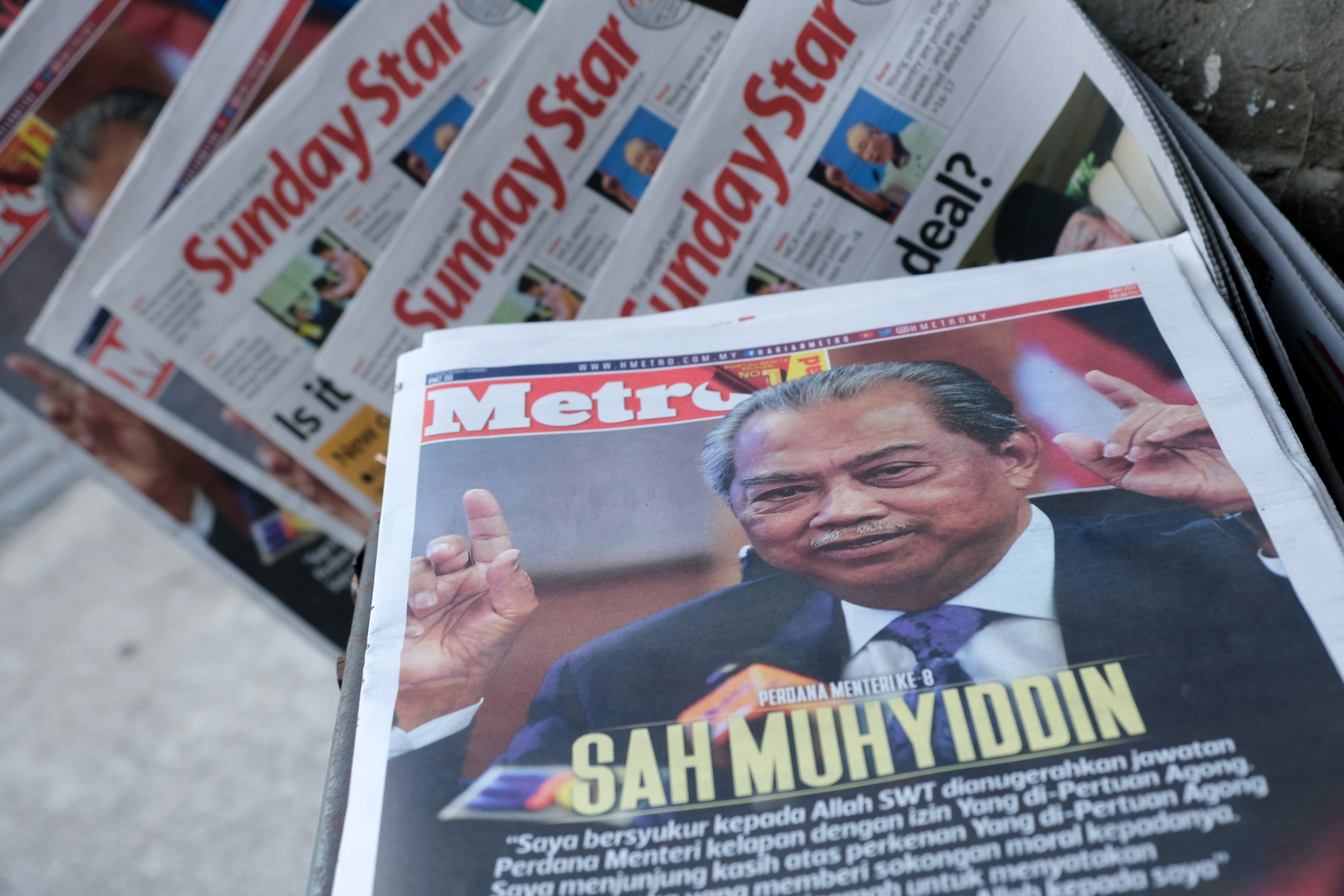 Malaysian prime minister-designate Muhyiddin Yassin features on the cover of a newspaper displayed at a stand in Kuala Lumpur on March 1. Muhyiddin, 72, was named prime minister the previous day by the country’s monarch to end a six-day tussle for power, after Mahathir Mohamad suddenly resigned. Photo: Bloomberg