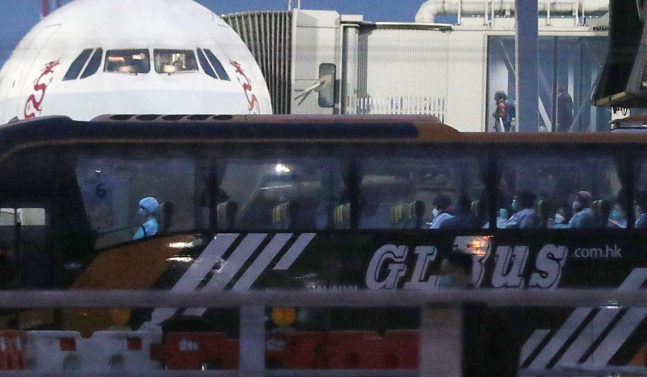A coach at Hong Kong’s airport transports city residents from Wuhan to a quarantine facility. Photo: Winson Wong