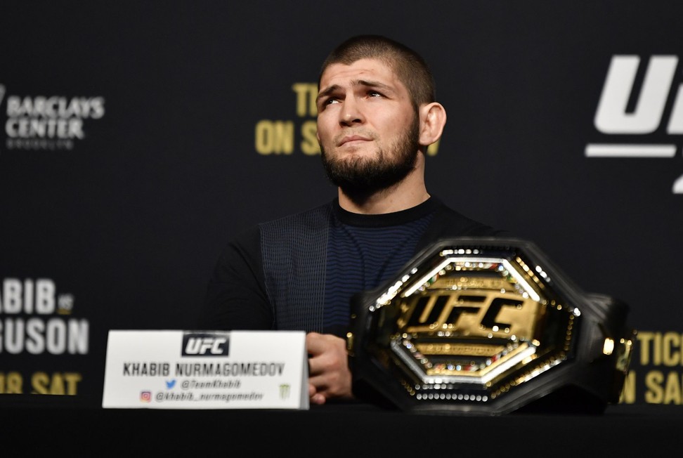 Khabib Nurmagomedov interacts with media during the UFC 249 press conference.