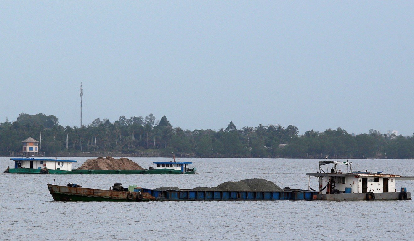 Ships transport sand on the Mekong River in Vietnam. Photo: Reuters