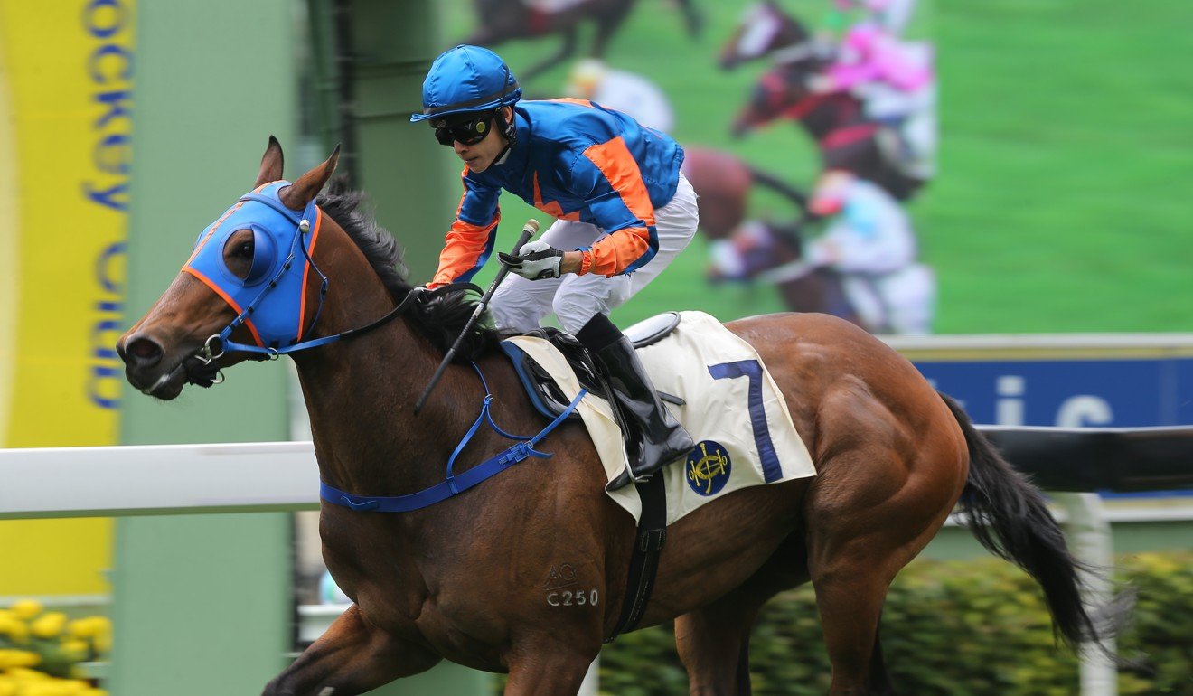 Victor Wong crosses the line to win aboard Smiling Success.