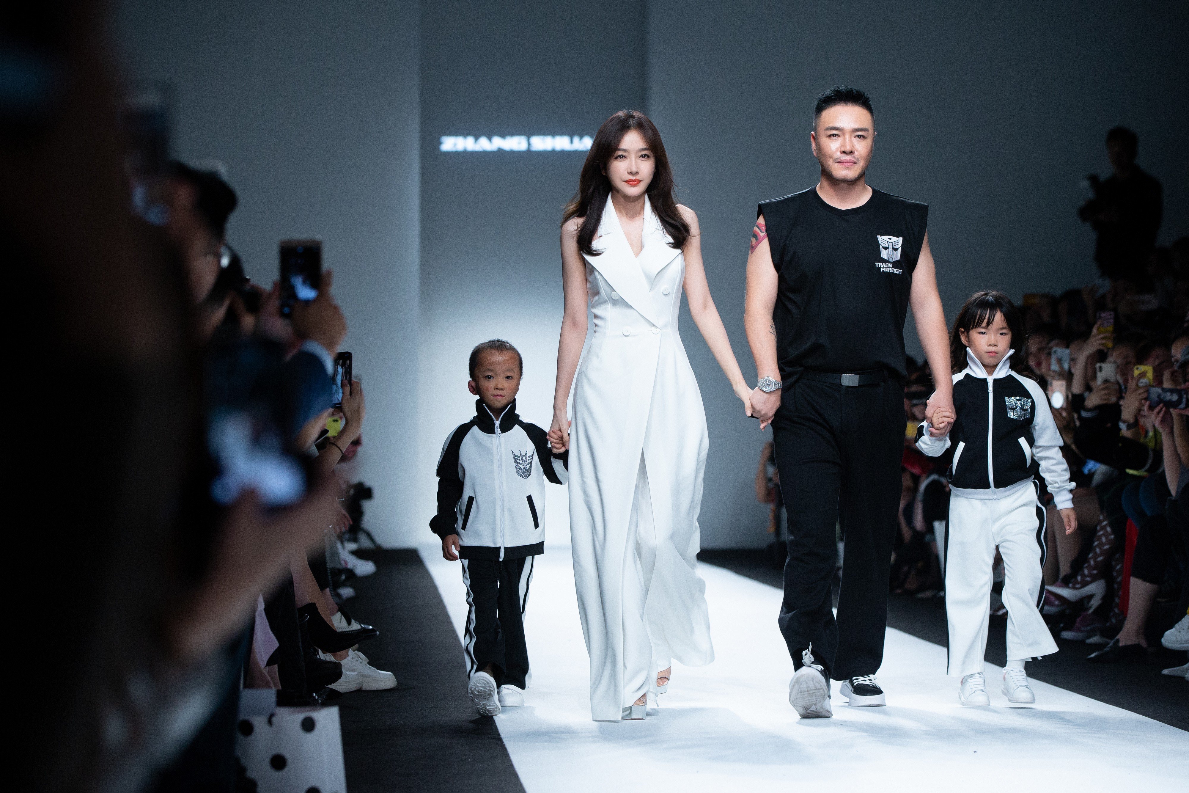 Actress Qin Lan and designer Zhang Shuai walk the runway during Zhang’s show at Shanghai Fashion Week in 2018. Photo: Getty Images