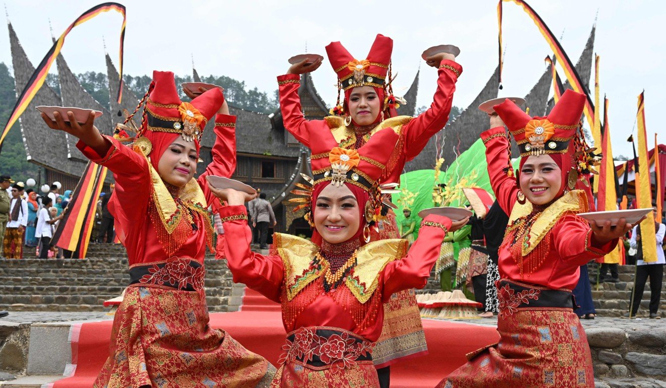 Dancers pose during the 2018 Minangkabau art and culture festival in Batusangkar, West Sumatra. Photo: AFP