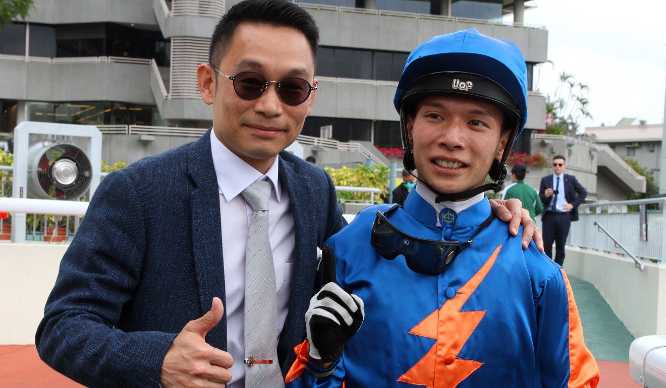 Trainer Jimmy Ting and jockey Victor Wong celebrate their victory.