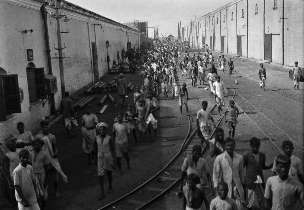 Workers go for their lunch hour at the Birla Jute Mill in Calcutta in the 1920s. Photo: Getty Images