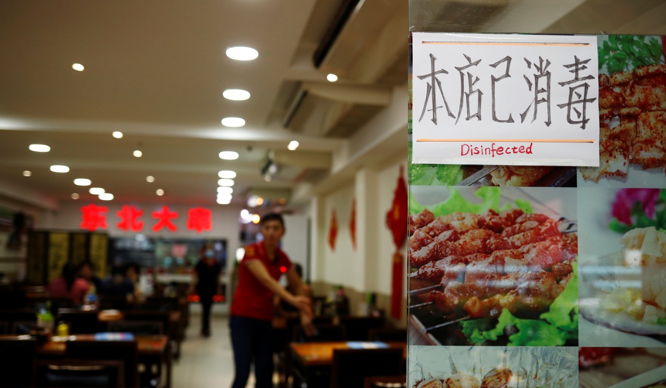 A Chinese restaurant in Singapore displays a sign that says ‘disinfected’ as businesses adapt to the outbreak. Photo: Reuters