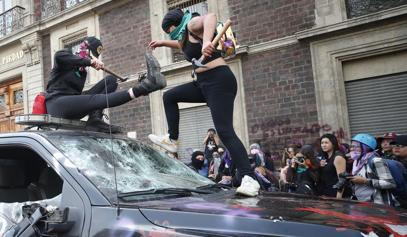 Demonstrators attack a truck belonging to the fire department in Mexico City. Photo: AP