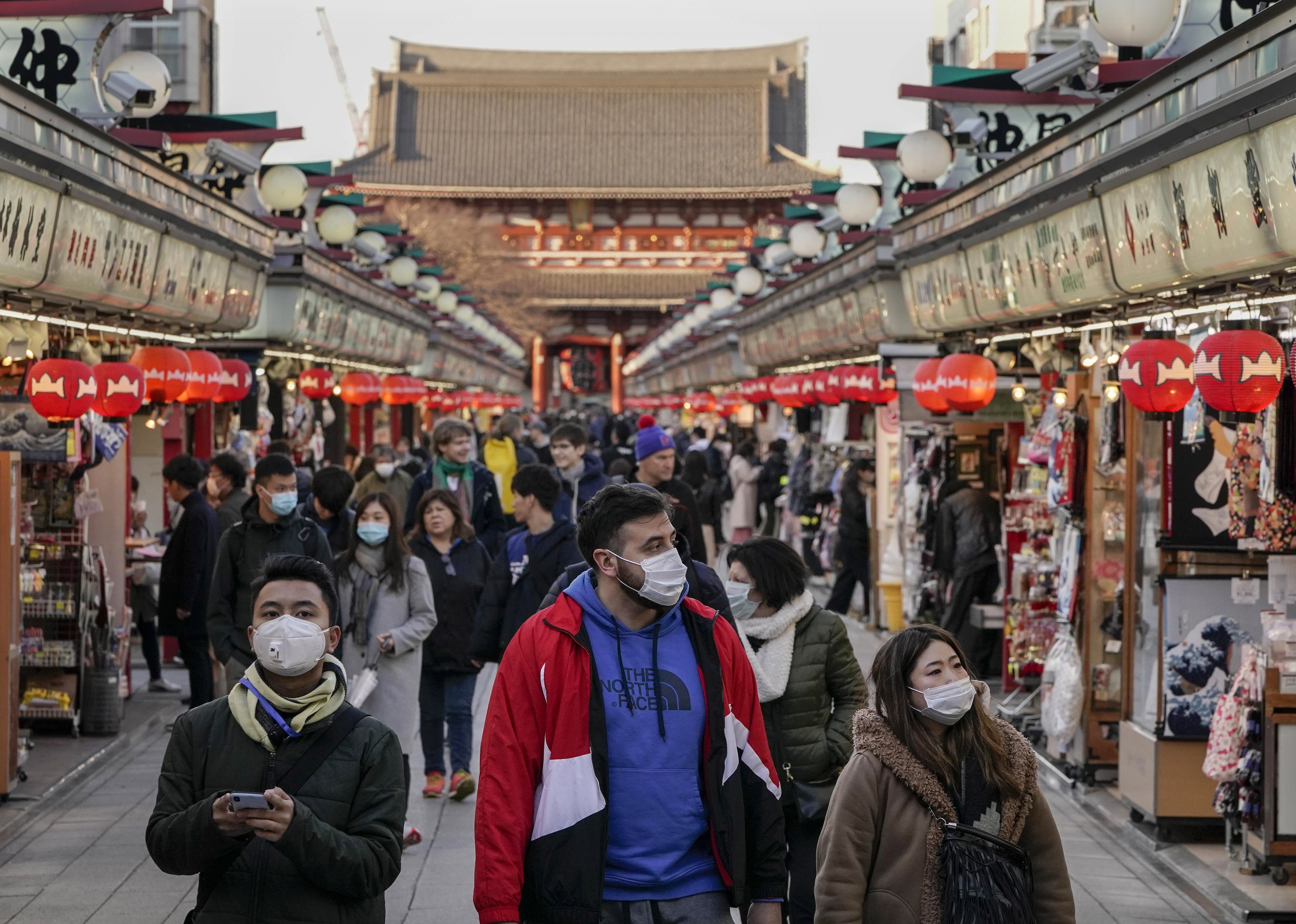 Tourists wearing masks seen in the Asakusa district of Tokyo, Japan, March 5, 2020. Overseas Chinese can use AliPay to get free online consultations with doctors in mainland China. Photo: EPA-EFE