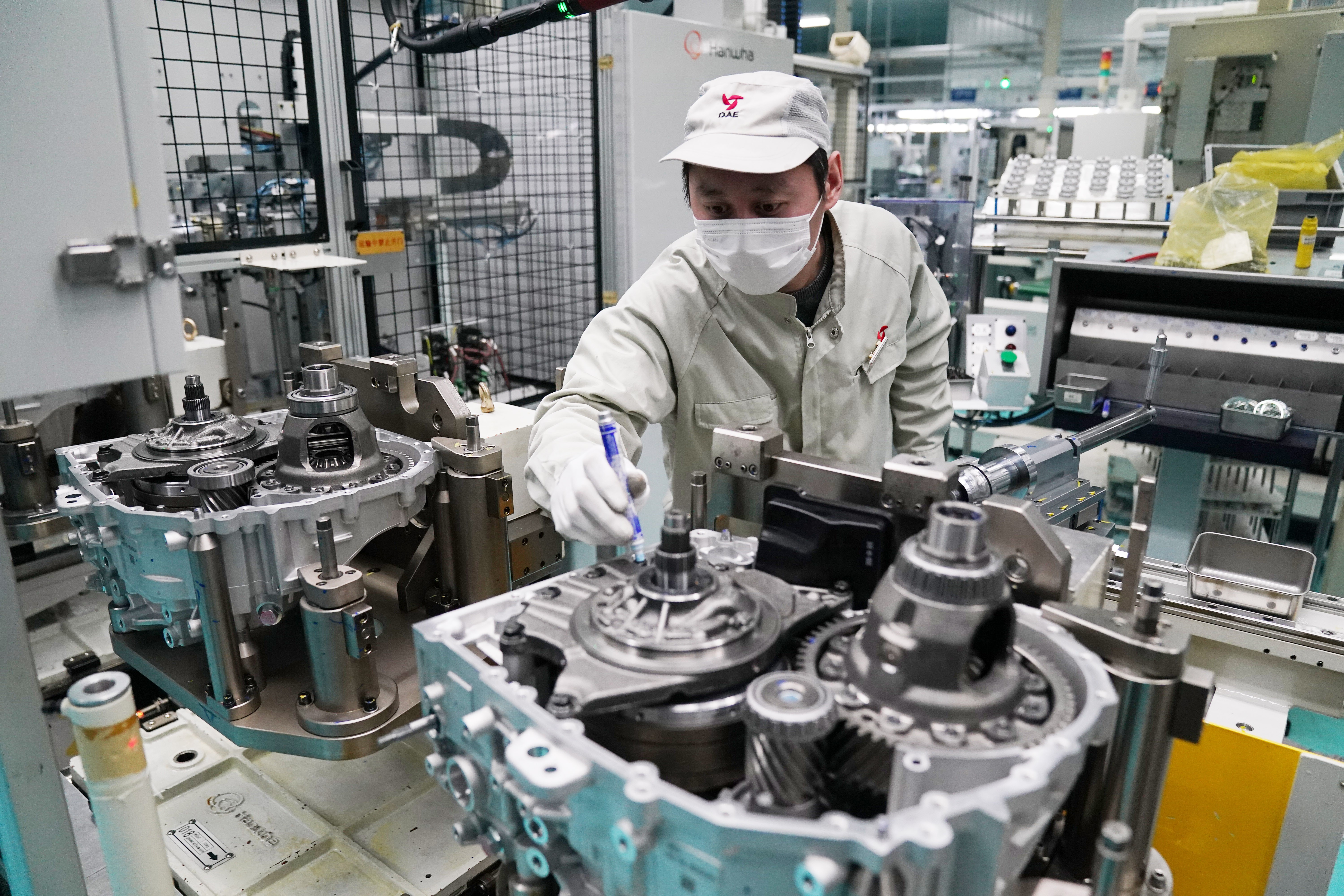 An employee at a workshop in Harbin Dongan Automotive Engine Manufacturing in China’s Heilongjiang province in February. Photo: Xinhua