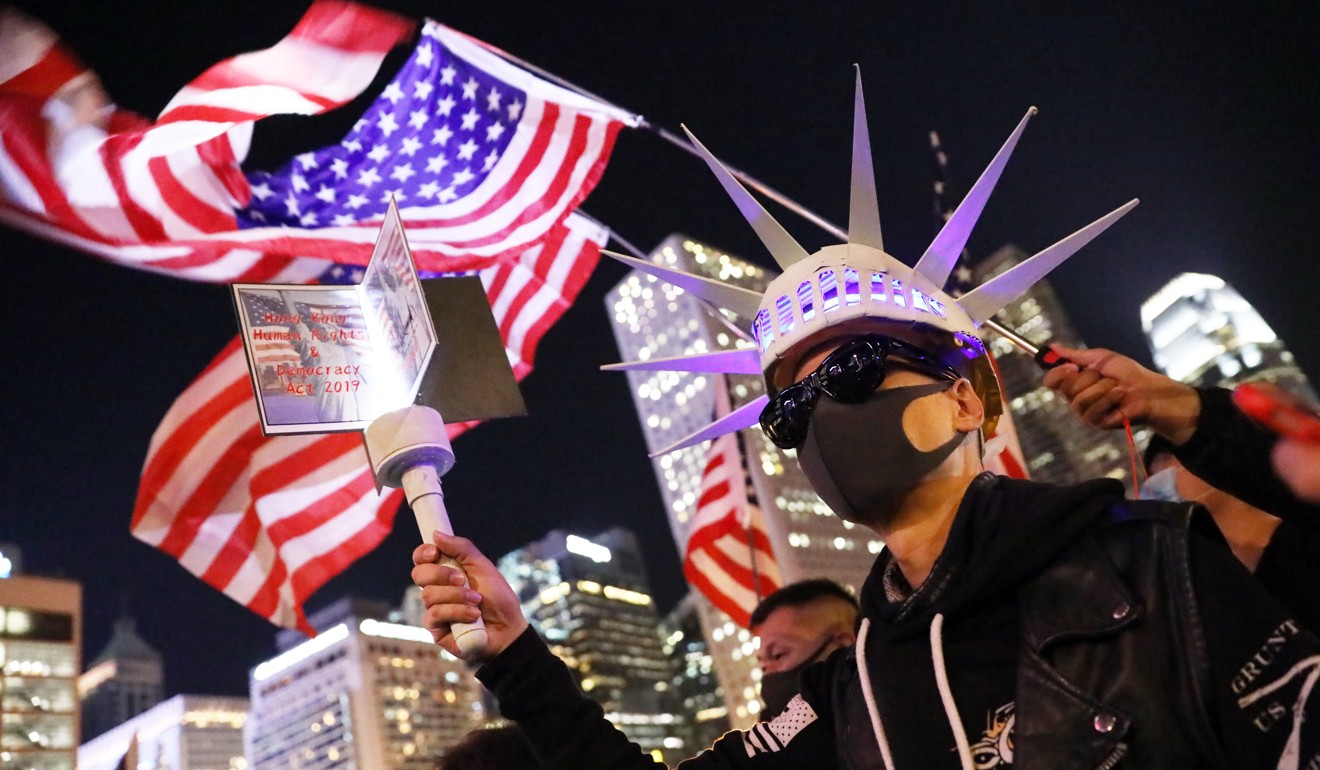 Protesters waving American flags attend a rally in Central in downtown Hong Kong on November 29 last year. Photo: K. Y. Cheng